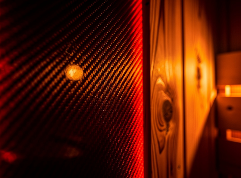 Premium infrared sauna cabin interior with carbon heating panels and cedar wood construction