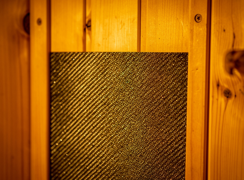 Premium cedar infrared sauna interior with consistent heater panel coverage on back and side walls