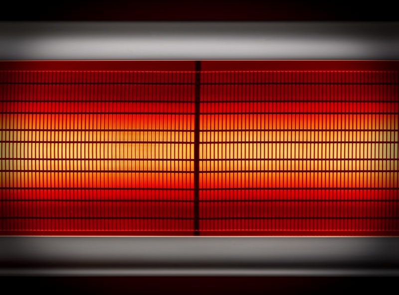 Close-up of infrared sauna carbon heating panels glowing with warm light