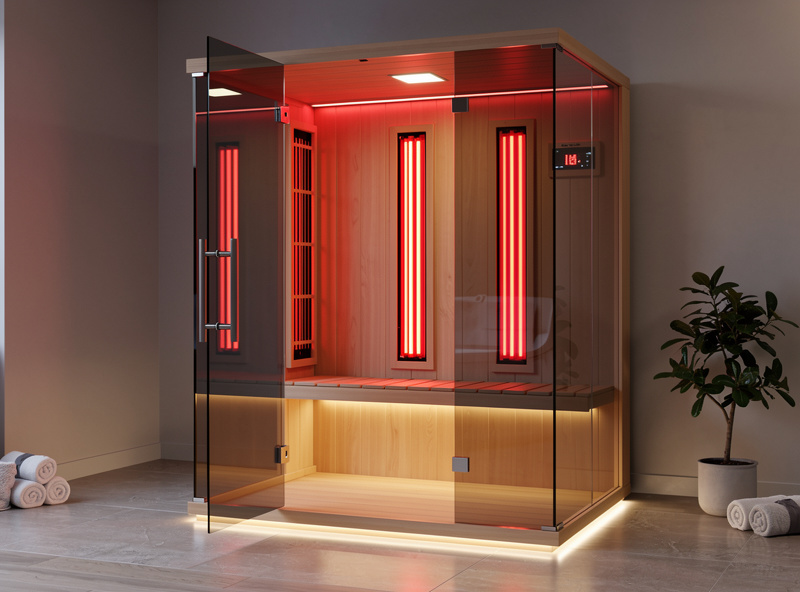 Modern infrared sauna in home setting with glass door and red light panels