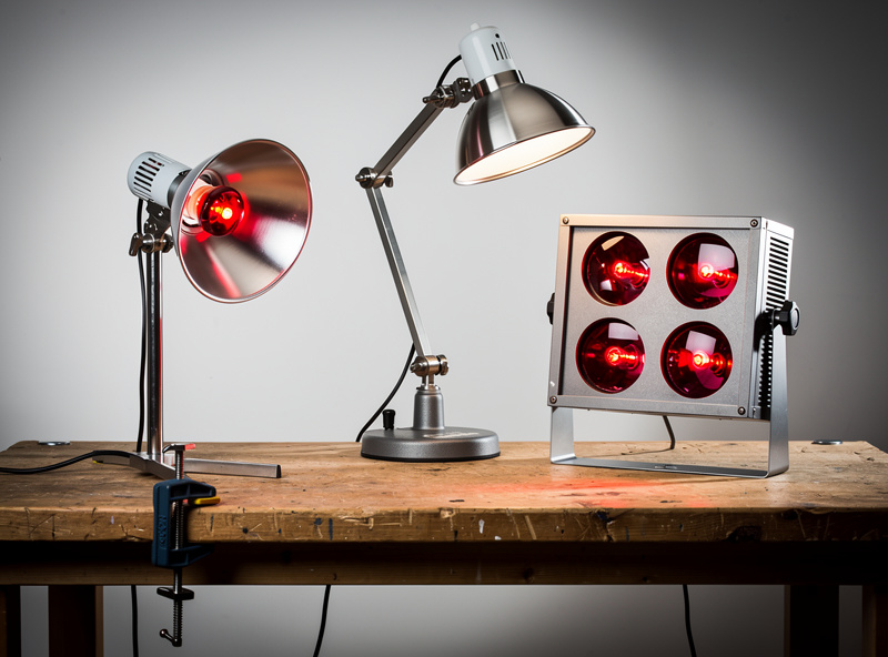 Three different near-infrared lamp fixtures: clamp lamp, adjustable stand, and four-bulb panel