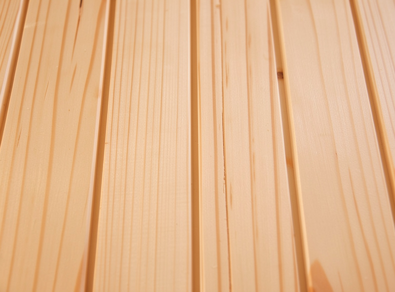Close-up of clear knot-free hemlock tongue-and-groove sauna boards