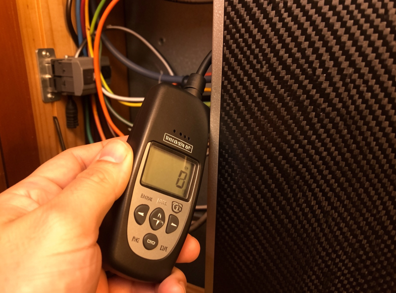 Mapping the magnetic field along the wiring run behind an infrared sauna heater panel with an EMF meter