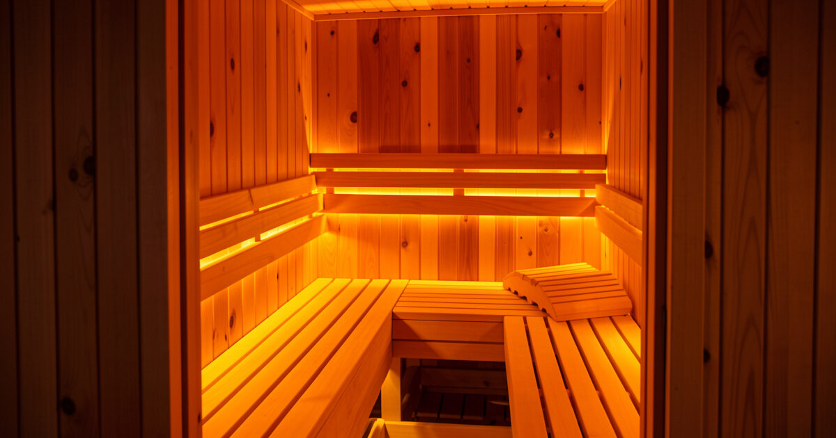 Infrared sauna cabin lit with warm amber chromotherapy LED light