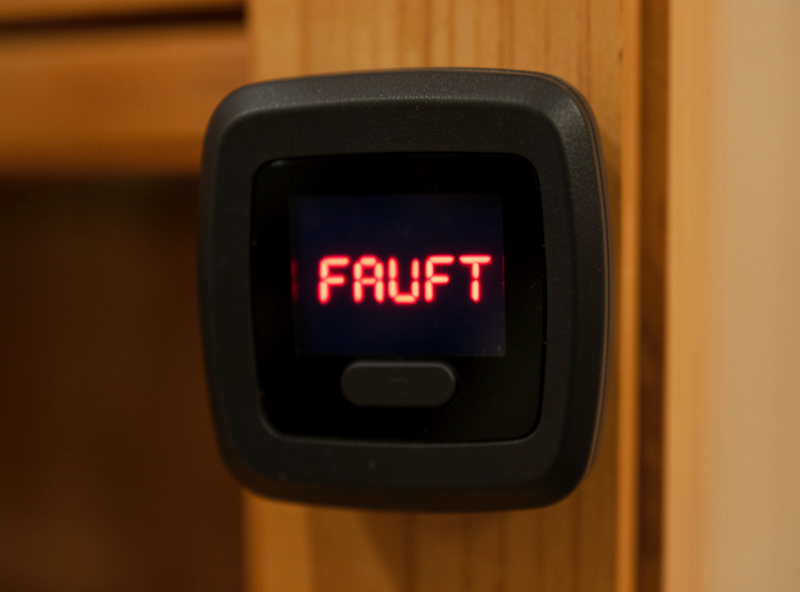 Infrared sauna control panel display showing an error code during a fault diagnosis