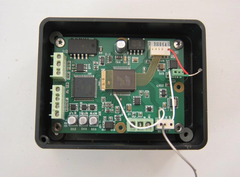 Temperature probe and ribbon cable connector inside an infrared sauna control board