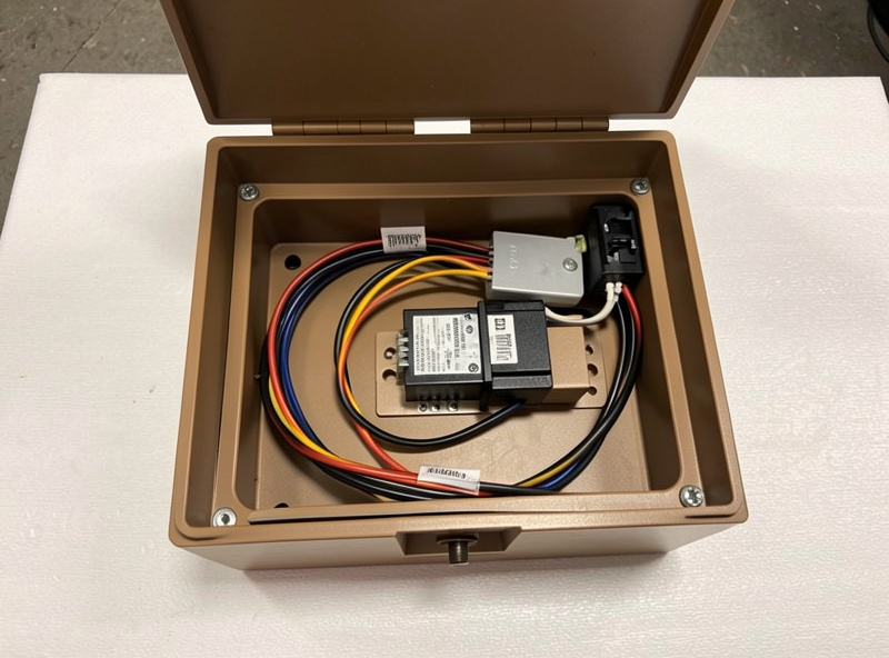 Infrared sauna controller and wiring harness opened up showing the relay and low-voltage display feed