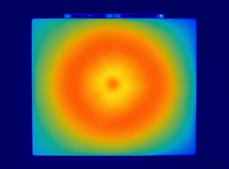 Thermal camera image of an infrared sauna panel showing surface temperature distribution and cold spots