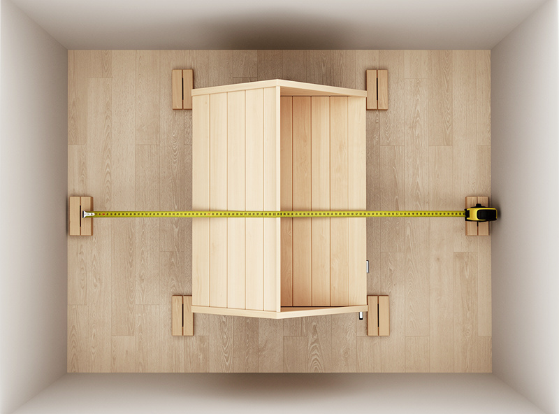 Overhead view of an infrared sauna with clearance gaps marked on all four sides