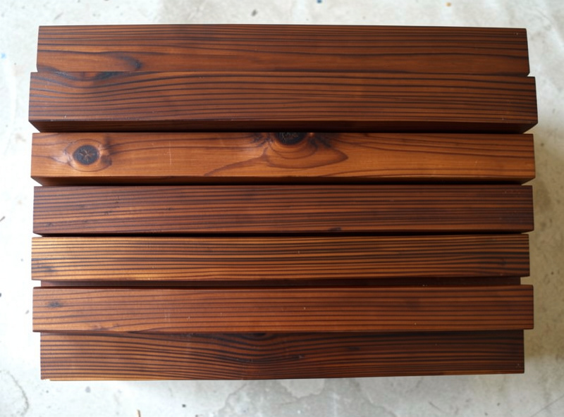Rich dark brown thermally modified pine boards with even color throughout the wood