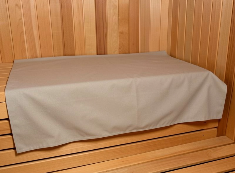 A washable fabric bench cover fitted neatly over a hemlock sauna bench