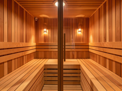 Facing-bench infrared sauna cabin with two benches on opposite hemlock walls